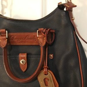 Never used Dooney&Bourke 100% leather purse !